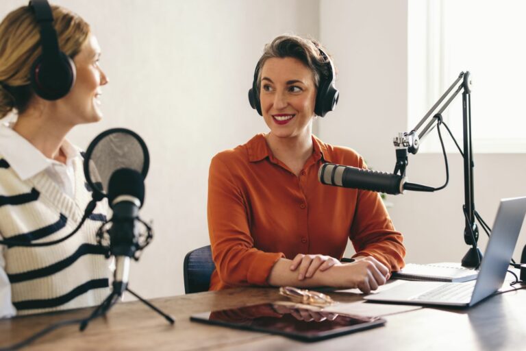 Two,Women,Having,A,Conversation,While,Co-hosting,An,Audio,Broadcast